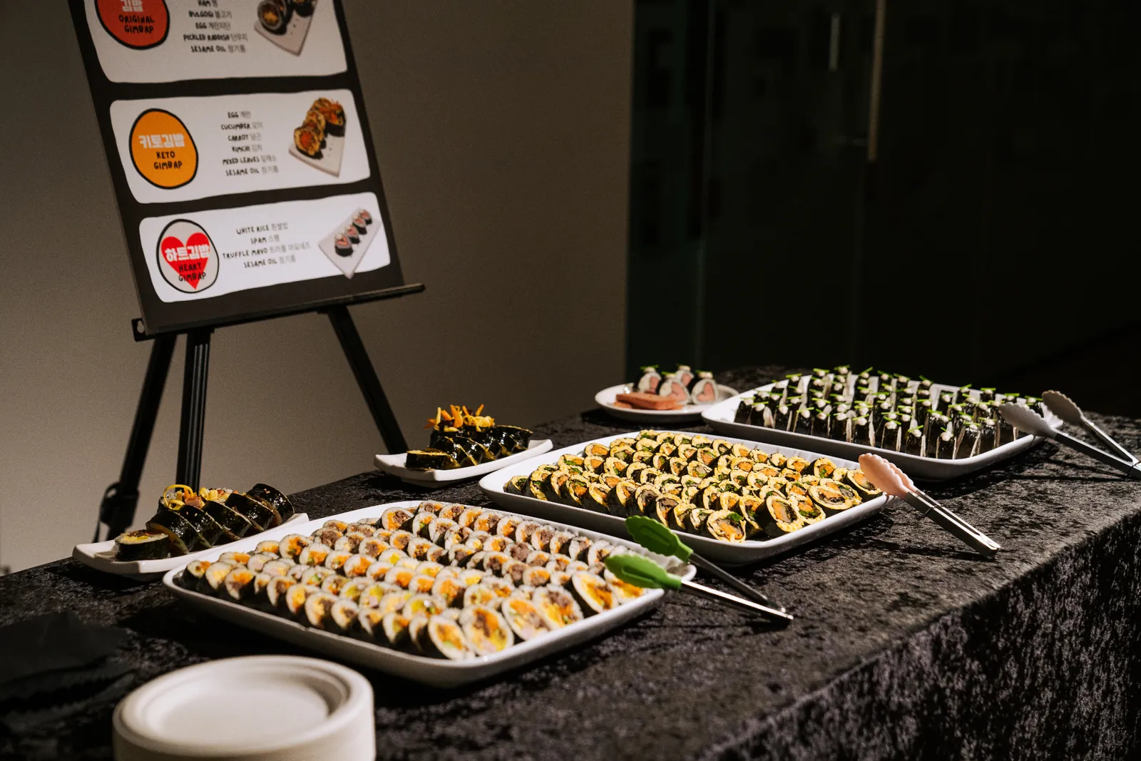 Chef plating a course in the Kreative Catering kitchen.